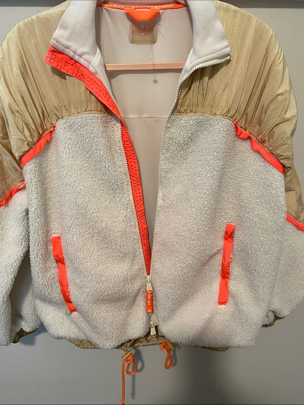 NWOT FP Movement by Free People Cream Jacket with Orange Trim Embroidered Logo